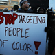 Dozens of protesters hold a demonstration and candlelight vigil in memory of Eric Garner outside the 120th Police Precinct Station Jan. 15, 2015, in New York City.
Spencer Platt/Getty Images